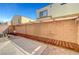 Private backyard with a covered patio area, brick accents, and outdoor space at 6320 Desert Leaf St # 101, North Las Vegas, NV 89081