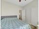 Bedroom with ceiling fan, comfortable bed with patterned quilt and closet at 6320 Desert Leaf St # 101, North Las Vegas, NV 89081