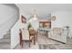 Dining area featuring hardwood floors, a decorative chandelier, and open access to the kitchen at 6320 Desert Leaf St # 101, North Las Vegas, NV 89081