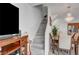 Dining area with hardwood floors next to staircase at 6320 Desert Leaf St # 101, North Las Vegas, NV 89081