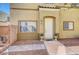 A welcoming front entrance, showcasing a neutral exterior with a well-maintained walkway at 6320 Desert Leaf St # 101, North Las Vegas, NV 89081