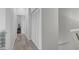 Hallway with modern wood-look floors at 6320 Desert Leaf St # 101, North Las Vegas, NV 89081