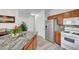 Spacious kitchen featuring stainless steel refrigerator and marble counters at 6320 Desert Leaf St # 101, North Las Vegas, NV 89081