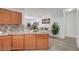 Open kitchen showcasing granite countertops and wood cabinets at 6320 Desert Leaf St # 101, North Las Vegas, NV 89081