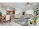 Open-concept living room and dining area with hardwood floors and a chandelier, perfect for entertaining at 6320 Desert Leaf St # 101, North Las Vegas, NV 89081