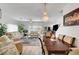 Open-concept design with hardwood floors combining the kitchen, dining, and living area, great for entertaining at 6320 Desert Leaf St # 101, North Las Vegas, NV 89081
