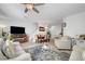 Bright living area boasts neutral tones, hardwood floors, and an open floor plan, ideal for modern living at 6320 Desert Leaf St # 101, North Las Vegas, NV 89081