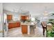 Bright, open floor plan showcases a modern kitchen with hardwood floors, flowing into the living area at 6320 Desert Leaf St # 101, North Las Vegas, NV 89081