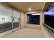 Spacious balcony featuring modern railings and views of the surrounding landscape and neighboring houses at 6338 Skystone St, Las Vegas, NV 89135