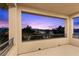 Outdoor balcony offers evening views of the neighborhood's trees and skyline during twilight at 6338 Skystone St, Las Vegas, NV 89135
