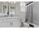 Cozy bathroom with white vanity, patterned shower curtain, and modern fixtures at 6338 Skystone St, Las Vegas, NV 89135