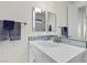 Bathroom featuring a sleek vanity, stylish mirror, and modern fixtures at 6338 Skystone St, Las Vegas, NV 89135