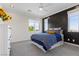 Inviting bedroom with modern accent wall, plush bedding, and bright natural light at 6338 Skystone St, Las Vegas, NV 89135