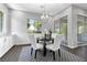 Dining area featuring modern chandelier and a view of the outdoor patio at 6338 Skystone St, Las Vegas, NV 89135