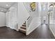 Bright entryway with hardwood floors, a staircase, and contemporary lighting fixtures at 6338 Skystone St, Las Vegas, NV 89135