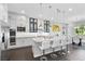 Modern kitchen with stainless steel appliances, a granite island, and ample cabinet space at 6338 Skystone St, Las Vegas, NV 89135