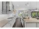 Spacious kitchen boasting granite countertops, stainless appliances, and an eat-in dining area at 6338 Skystone St, Las Vegas, NV 89135