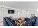 Inviting living room with custom built-ins and stylish, comfortable sectional seating arrangement at 6338 Skystone St, Las Vegas, NV 89135