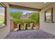 Charming outdoor patio with desert landscaping and stylish planters at 6338 Skystone St, Las Vegas, NV 89135