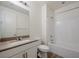 Bright bathroom featuring a single sink vanity with white cabinets and a shower over tub at 6403 Ava Ridge Ave, Las Vegas, NV 89141