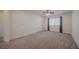 Spacious bedroom with neutral carpet and a ceiling fan at 6403 Ava Ridge Ave, Las Vegas, NV 89141