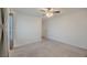 Bedroom featuring carpet, ceiling fan, and window with curtains at 6403 Ava Ridge Ave, Las Vegas, NV 89141