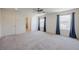 Well-lit bedroom with neutral carpet and dual windows at 6403 Ava Ridge Ave, Las Vegas, NV 89141