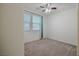 Bedroom featuring carpet, ceiling fan, and natural light from the windows at 6403 Ava Ridge Ave, Las Vegas, NV 89141