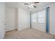 Neutral bedroom with a ceiling fan, carpet, and a closet with sliding doors at 6403 Ava Ridge Ave, Las Vegas, NV 89141