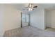 Cozy bedroom featuring neutral carpet, a ceiling fan, and window with blinds at 6403 Ava Ridge Ave, Las Vegas, NV 89141