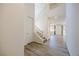 Inviting foyer with wood-look tile floors and a staircase at 6403 Ava Ridge Ave, Las Vegas, NV 89141