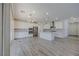 Open concept kitchen with white cabinetry, an island, and stainless steel appliances at 6403 Ava Ridge Ave, Las Vegas, NV 89141