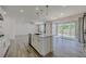 Bright, open-concept kitchen with an island and easy access to the backyard through sliding glass doors at 6403 Ava Ridge Ave, Las Vegas, NV 89141
