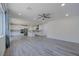 Spacious living room featuring recessed lighting, wood floors and open concept kitchen with island at 6403 Ava Ridge Ave, Las Vegas, NV 89141