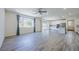 Spacious living room with hardwood floors and large windows at 6403 Ava Ridge Ave, Las Vegas, NV 89141