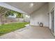 Backyard featuring a covered patio, a patch of grass, a tree with a swing, and a block wall at 7267 W Mesa Vista Ave, Las Vegas, NV 89113