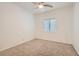 This bedroom features neutral carpeting, a window with blinds, and ample natural light at 7267 W Mesa Vista Ave, Las Vegas, NV 89113