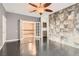 Bedroom with a view with decorative wall and a ceiling fan at 7267 W Mesa Vista Ave, Las Vegas, NV 89113