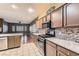 Well-equipped kitchen with stainless steel appliances and tiled backsplash at 7267 W Mesa Vista Ave, Las Vegas, NV 89113