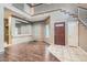 Entryway featuring tile floor, hardwood and a staircase at 7267 W Mesa Vista Ave, Las Vegas, NV 89113