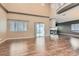 Spacious living room with vaulted ceilings, fireplace, and sliding glass doors to the backyard at 7267 W Mesa Vista Ave, Las Vegas, NV 89113