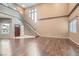 Bright living room boasts hardwood floors, a staircase, and large windows for natural light at 7267 W Mesa Vista Ave, Las Vegas, NV 89113