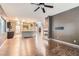 Open-concept living room with fireplace and access to the kitchen area at 7267 W Mesa Vista Ave, Las Vegas, NV 89113