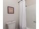 Clean bathroom featuring a framed print and neutral shower curtain at 768 Lawrence Dr, Henderson, NV 89015