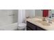 Well-lit bathroom with shower, solid surface vanity, and coordinating fixtures at 768 Lawrence Dr, Henderson, NV 89015