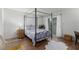 Bright bedroom featuring a large bed, and access to a sliding glass door at 768 Lawrence Dr, Henderson, NV 89015
