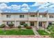 Desirable two-story condo showcases manicured lawn, vibrant greenery, and a cozy, private balcony at 768 Lawrence Dr, Henderson, NV 89015