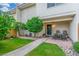 Inviting front porch featuring a seating area and well-manicured lawn, perfect for relaxing outdoors at 768 Lawrence Dr, Henderson, NV 89015