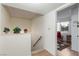 Hallway leading to a room with a red chair, natural light, and a decorative rug at 768 Lawrence Dr, Henderson, NV 89015