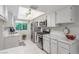 Bright kitchen with marble countertops, stainless steel appliances, and a garden view window at 768 Lawrence Dr, Henderson, NV 89015